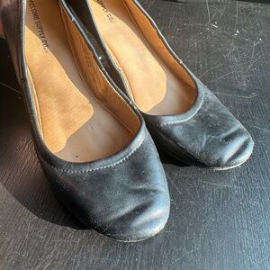 Black faux leather ballet flats